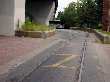 Buses ride in the right-of-way of the unused Green Line trolley loop at Forest Hills