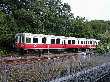 Red Line train passes commuter platform at Braintree