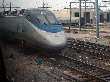 Acela Express power car is seen from commuter train as it passes Southampton Yard