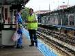 Irwin chats with one of his coworkers at Howard station