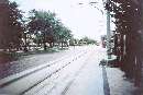 A car approaches the Centennial Park station along 8th Avenue