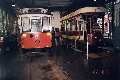 Inside the carbarn another open trolley and a double-decker being rehabilitated