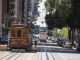 Several cable cars in service on the steep California Street.