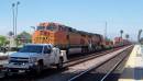 Entertainment in Riverside as a BNSF freight and high railer pass thru the station.