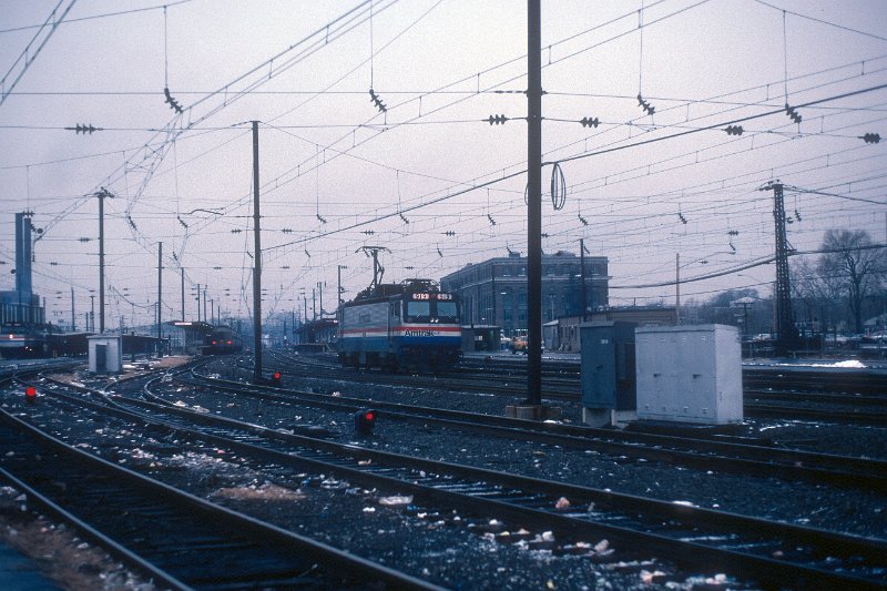 19820537-amtk.jpg - Amtrak AEM-7 #919 backs through New Haven station after having brough train 292 (extreme left) from New York City. December 23, 1982. 