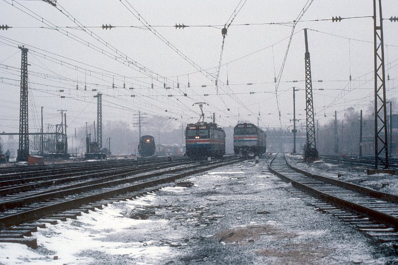 19820548-amtk.jpg - Amtrak F40s #201 and #207 have just cut off from train 293 (New England Metroliner), as 938 prepares to couple to the train for the remaining journey to New York City. December 23, 1982.